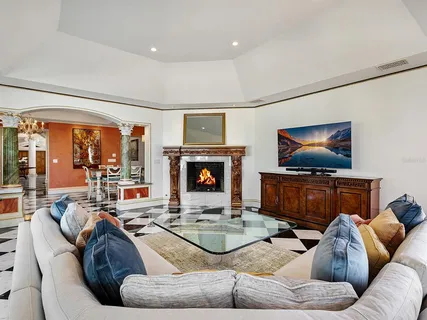 a bathroom with a granite countertop bathtub next to a window and a shower