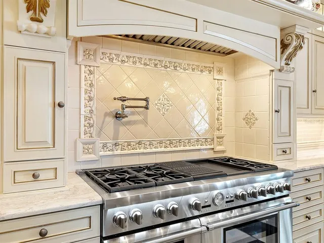 a bathroom with a granite countertop sink and a large mirror
