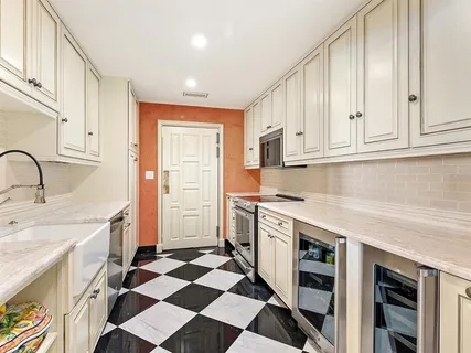 a bathroom with a shower curtain and a sink
