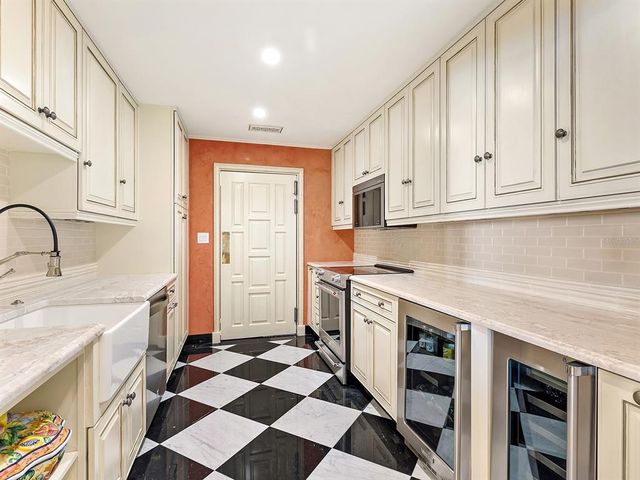 a bathroom with a shower curtain and a sink