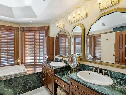 a view of swimming pool with outdoor seating yard and palm tree