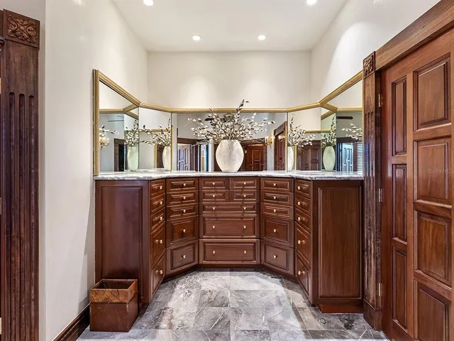 a front view of a house with swimming pool having outdoor seating