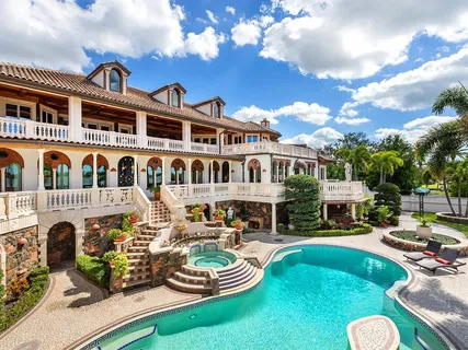 a swimming pool with outdoor seating and yard