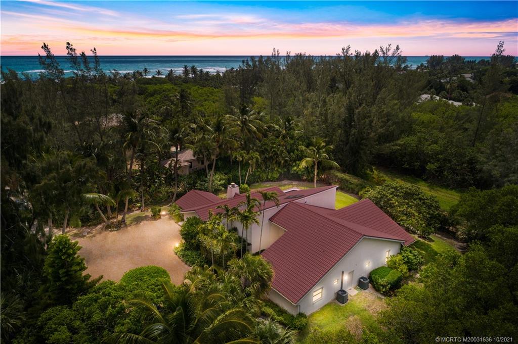 114 North Beach Road Hobe Sound, FL 33455 - Photo 1 of 37 a view of a swimming pool with a yard