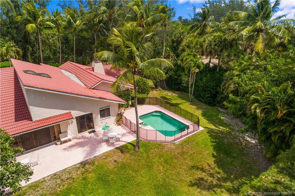 114 North Beach Road Hobe Sound, FL 33455 - Photo 11 of 37 a view of a house with pool yard and deck