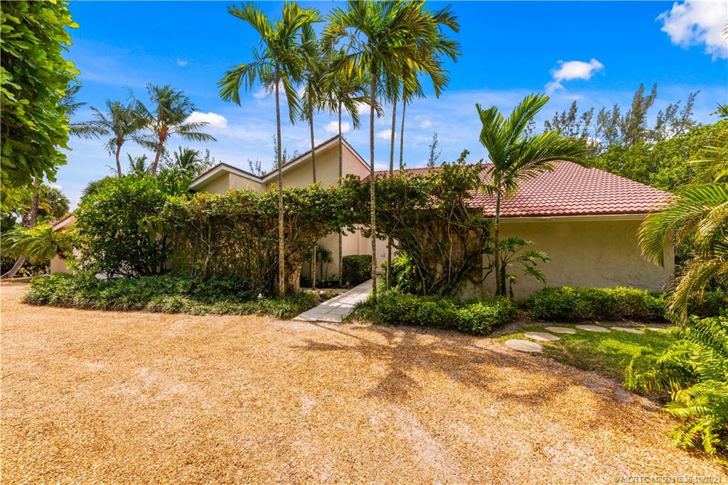 114 North Beach Road Hobe Sound, FL 33455 - Photo 13 of 37 a view of a backyard of the house