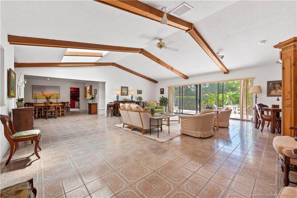 114 North Beach Road Hobe Sound, FL 33455 - Photo 15 of 37 a living room with fireplace furniture and a large window