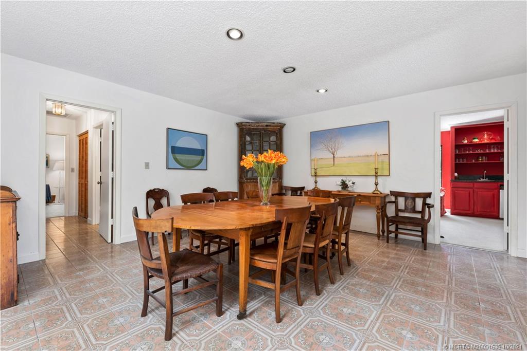 114 North Beach Road Hobe Sound, FL 33455 - Photo 18 of 37 a view of a dining room with furniture