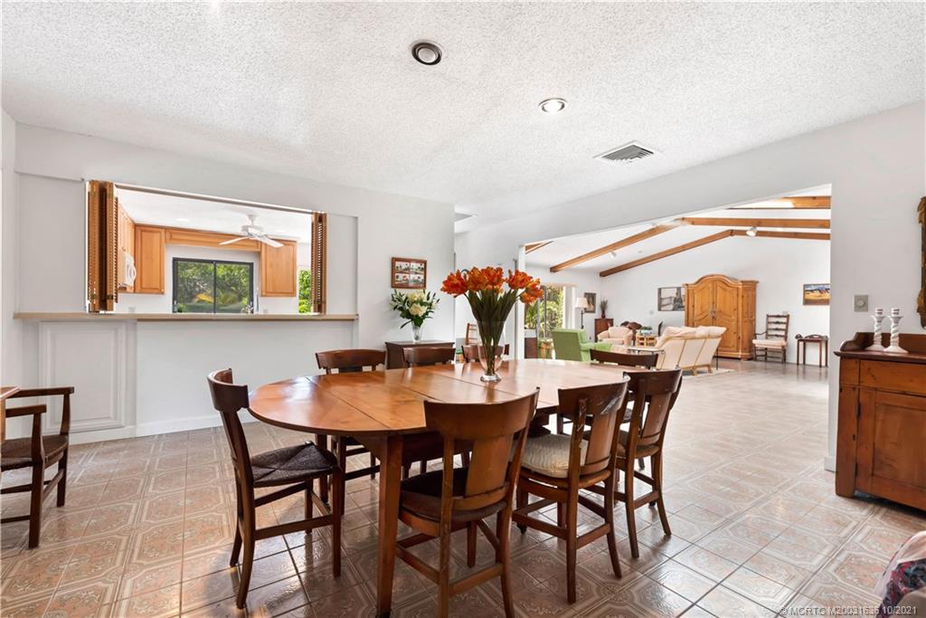 114 North Beach Road Hobe Sound, FL 33455 - Photo 19 of 37 a dining room with furniture and window