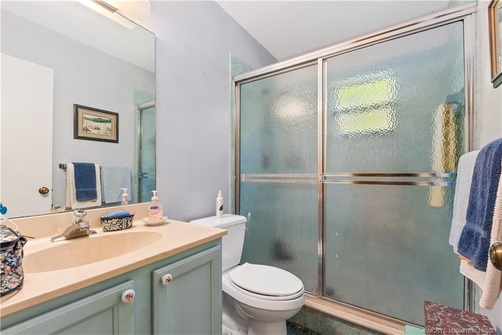 114 North Beach Road Hobe Sound, FL 33455 - Photo 24 of 37 a bathroom with a sink toilet and shower
