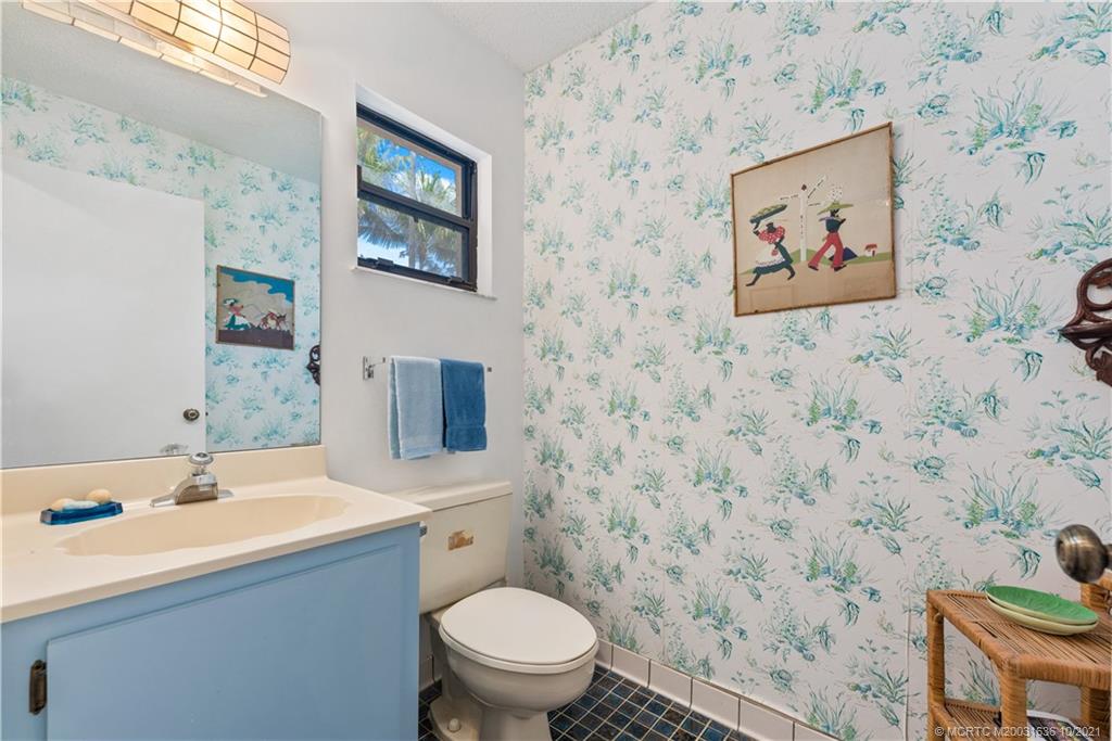 114 North Beach Road Hobe Sound, FL 33455 - Photo 30 of 37 a bathroom with a sink and a toilet