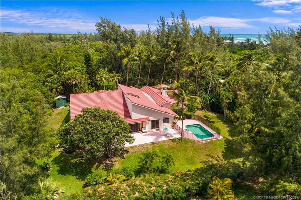 114 North Beach Road Hobe Sound, FL 33455 - Photo 10 of 37 a view of a house with a yard