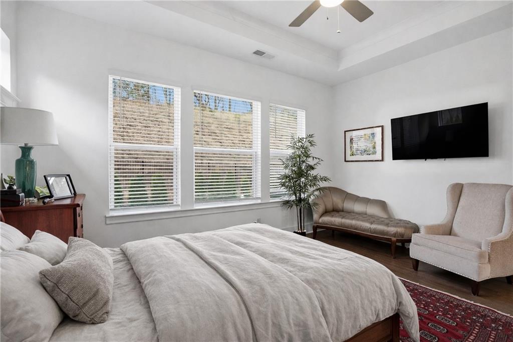 6742 Welcome Road Flowery Branch, GA 30542 - Photo 16 of 48 a bedroom with a bed and a couch