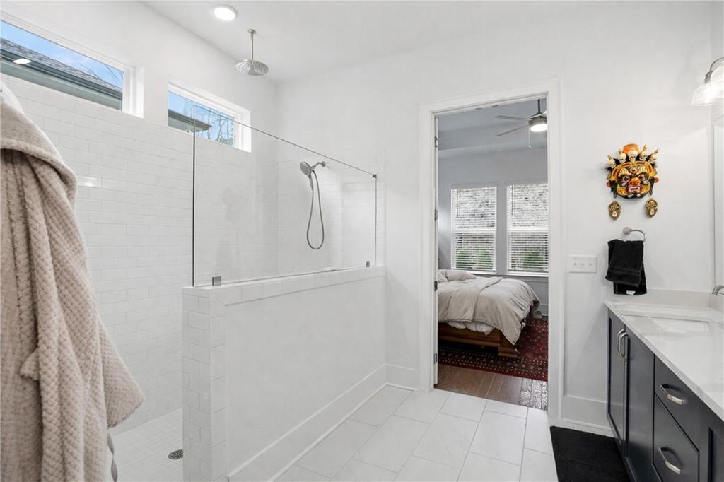 6742 Welcome Road Flowery Branch, GA 30542 - Photo 17 of 48 a bedroom with a bed and a window