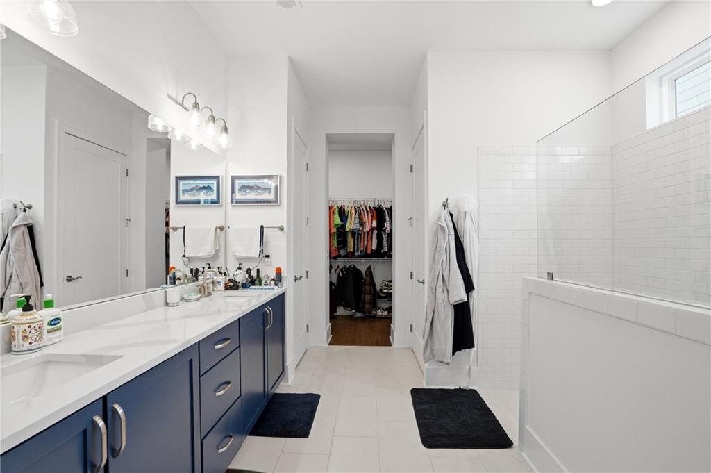 6742 Welcome Road Flowery Branch, GA 30542 - Photo 18 of 48 a kitchen with a sink a counter and cabinets