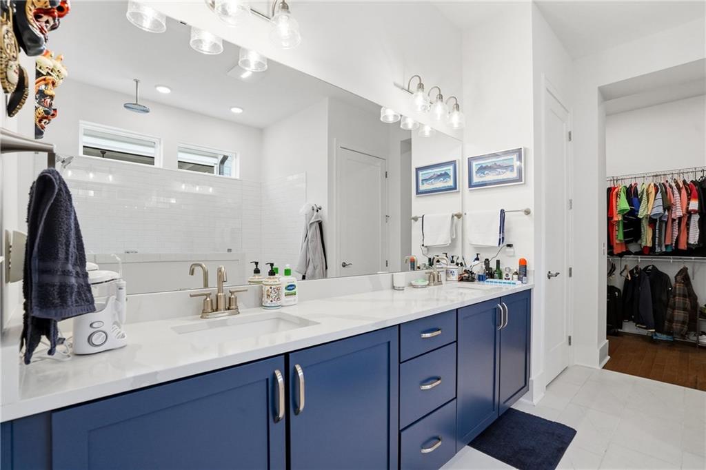 6742 Welcome Road Flowery Branch, GA 30542 - Photo 19 of 48 a bathroom with a sink double vanity and a mirror