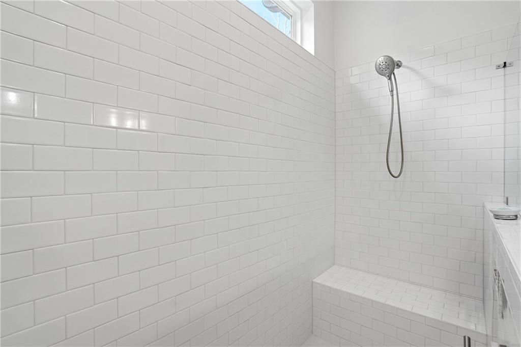 6742 Welcome Road Flowery Branch, GA 30542 - Photo 20 of 48 a bathroom with a shower