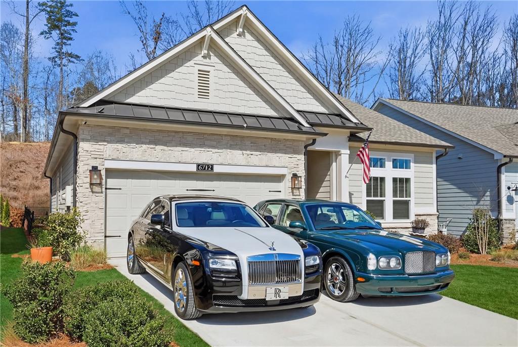 6742 Welcome Road Flowery Branch, GA 30542 - Photo 2 of 48 a front view of a house with parking