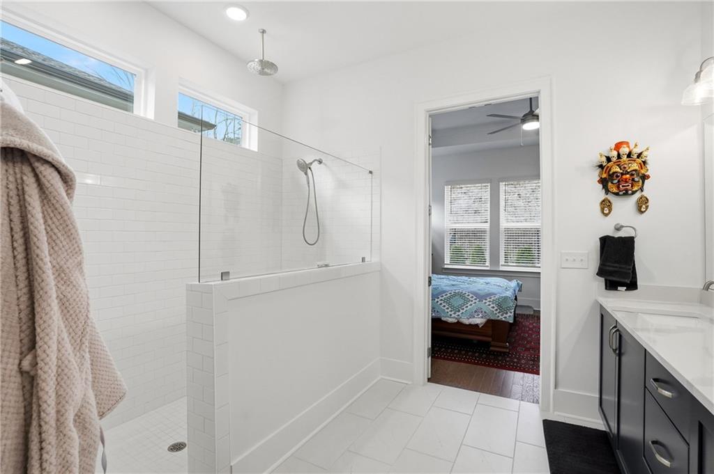 6742 Welcome Road Flowery Branch, GA 30542 - Photo 21 of 48 a bathroom with a sink and a mirror