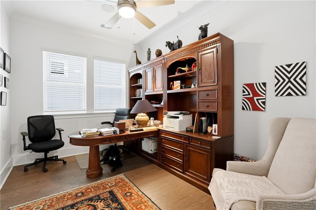 6742 Welcome Road Flowery Branch, GA 30542 - Photo 23 of 48 a work room with furniture and a rug