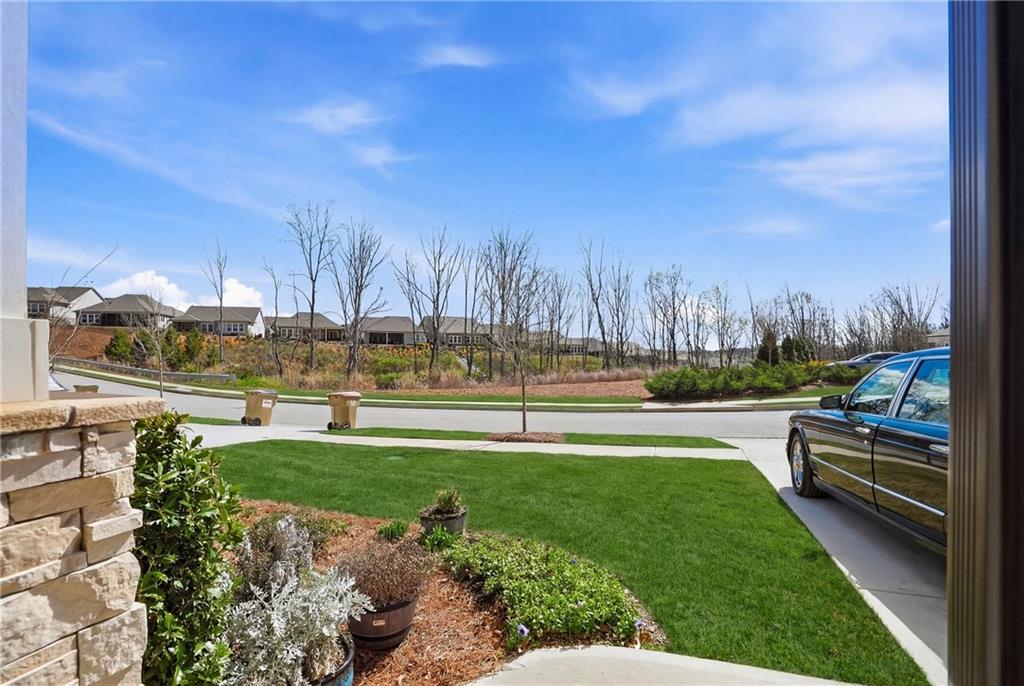 6742 Welcome Road Flowery Branch, GA 30542 - Photo 33 of 48 a view of swimming pool with lawn chairs and a big yard