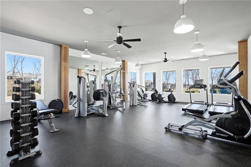 6742 Welcome Road Flowery Branch, GA 30542 - Photo 36 of 48 a view of a room with gym equipment