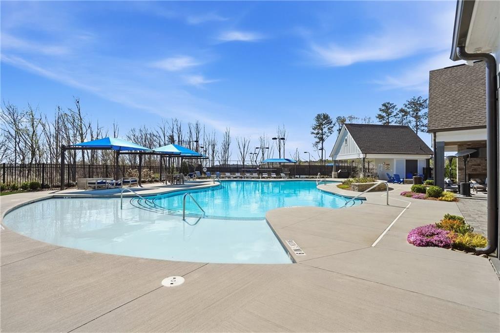 6742 Welcome Road Flowery Branch, GA 30542 - Photo 38 of 48 a view of swimming pool with outdoor seating and yard in the back
