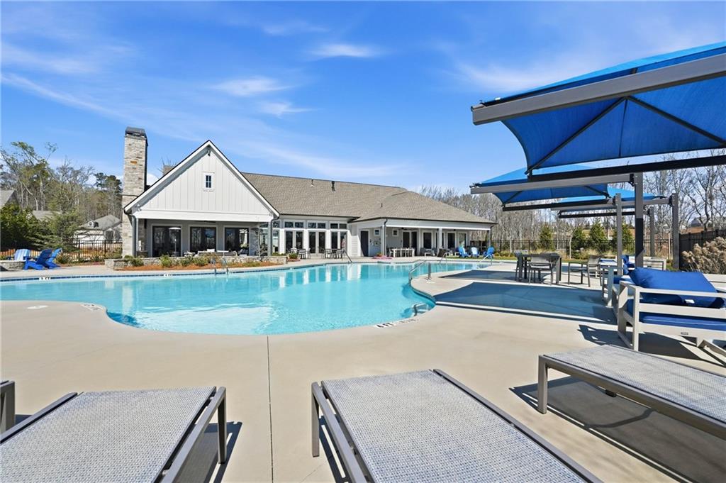 6742 Welcome Road Flowery Branch, GA 30542 - Photo 39 of 48 a view of house with swimming pool outdoor seating