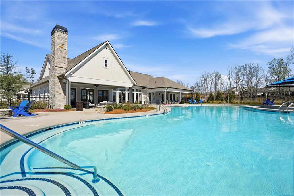 6742 Welcome Road Flowery Branch, GA 30542 - Photo 40 of 48 a view of a house with swimming pool yard and porch