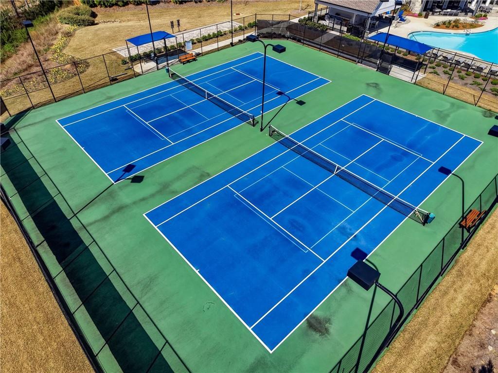 6742 Welcome Road Flowery Branch, GA 30542 - Photo 43 of 48 a view of a tennis ground with wooden floor