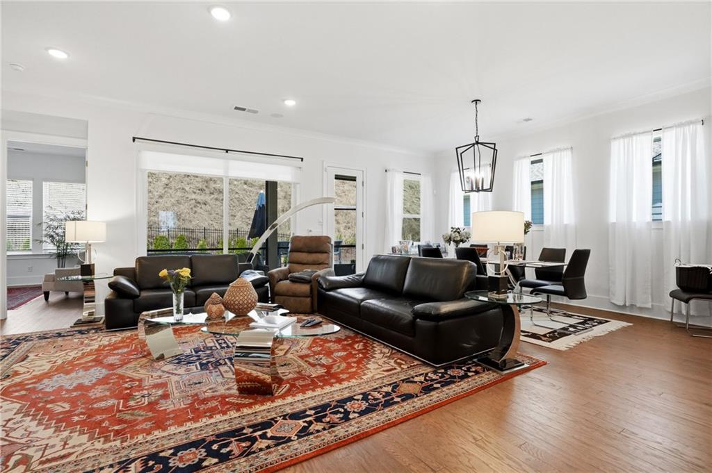 6742 Welcome Road Flowery Branch, GA 30542 - Photo 5 of 48 a living room with furniture window and wooden floor