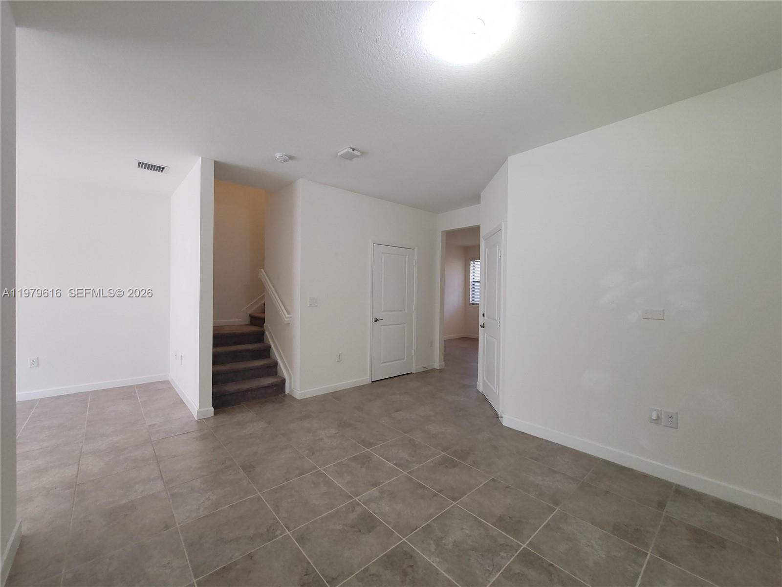 25039 Southwest 114th Avenue Homestead, FL 33032 - Photo 13 of 45 an empty room with a empty space