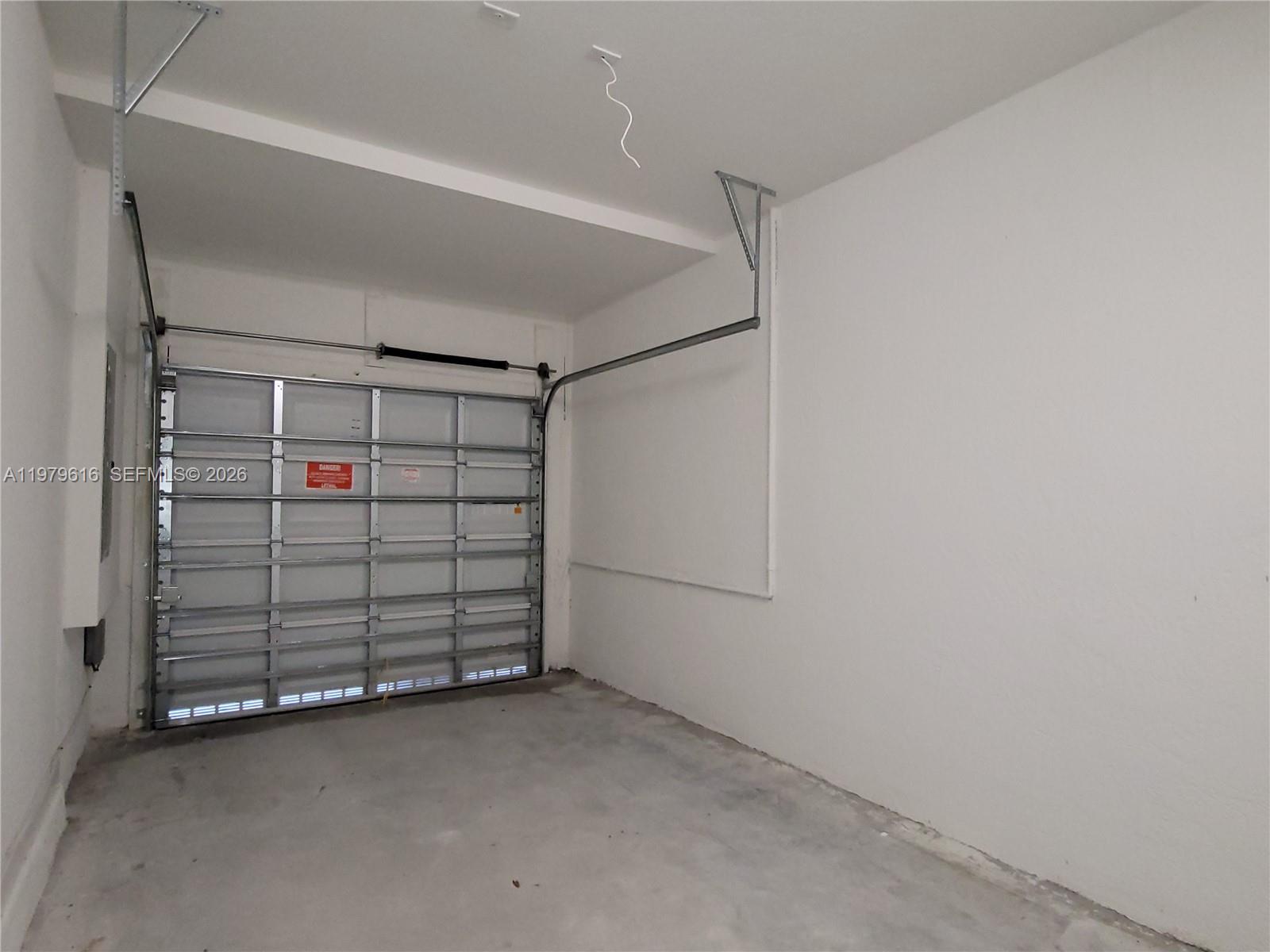 25039 Southwest 114th Avenue Homestead, FL 33032 - Photo 19 of 45 a view of a garage with storage