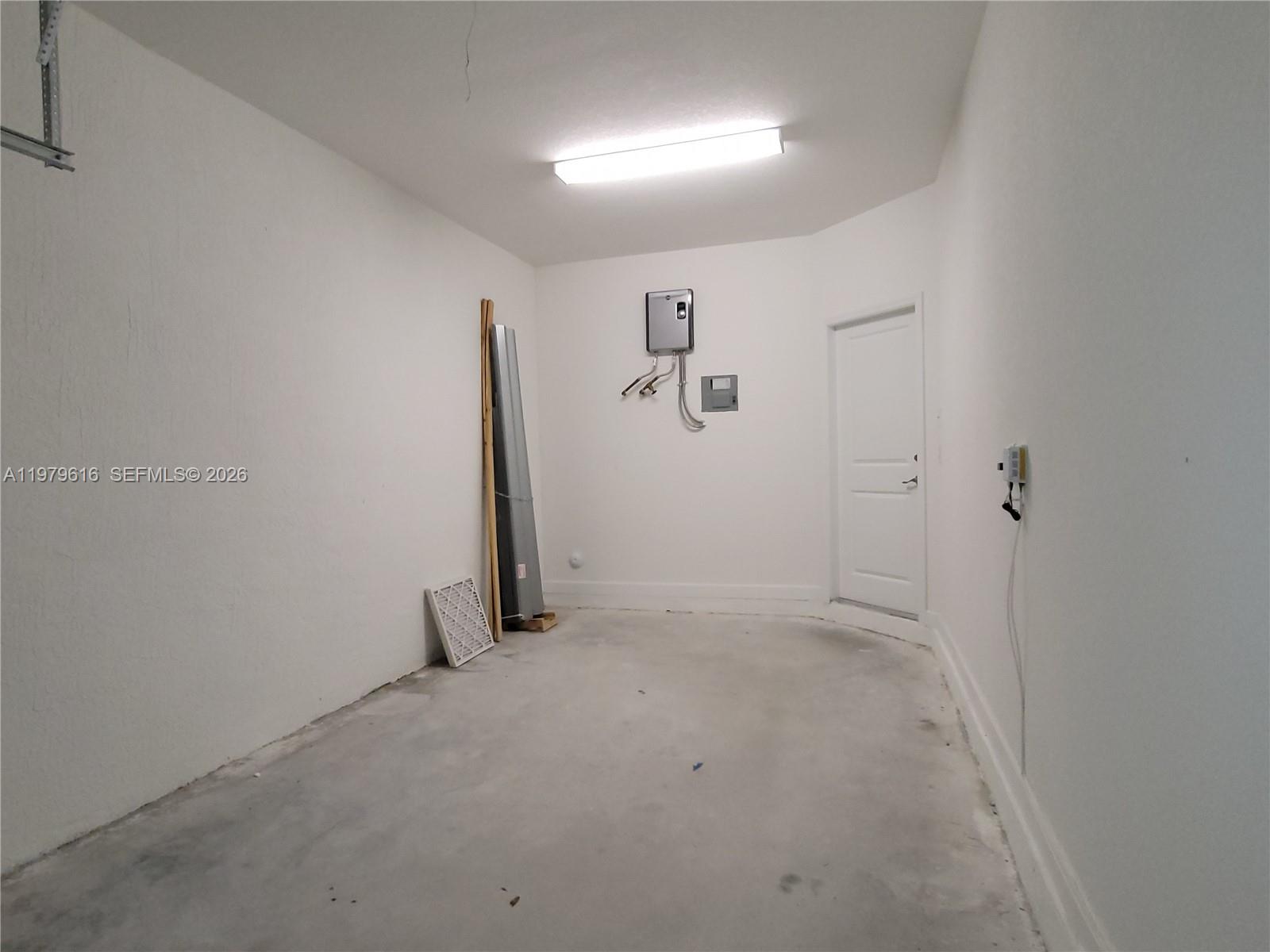 25039 Southwest 114th Avenue Homestead, FL 33032 - Photo 20 of 45 an empty room with a door