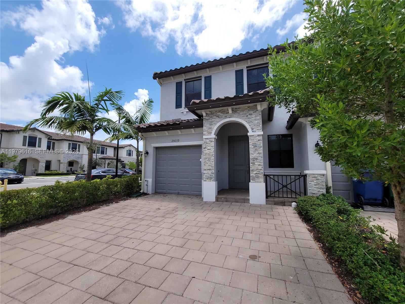 25039 Southwest 114th Avenue Homestead, FL 33032 - Photo 2 of 45 a house view with a outdoor space