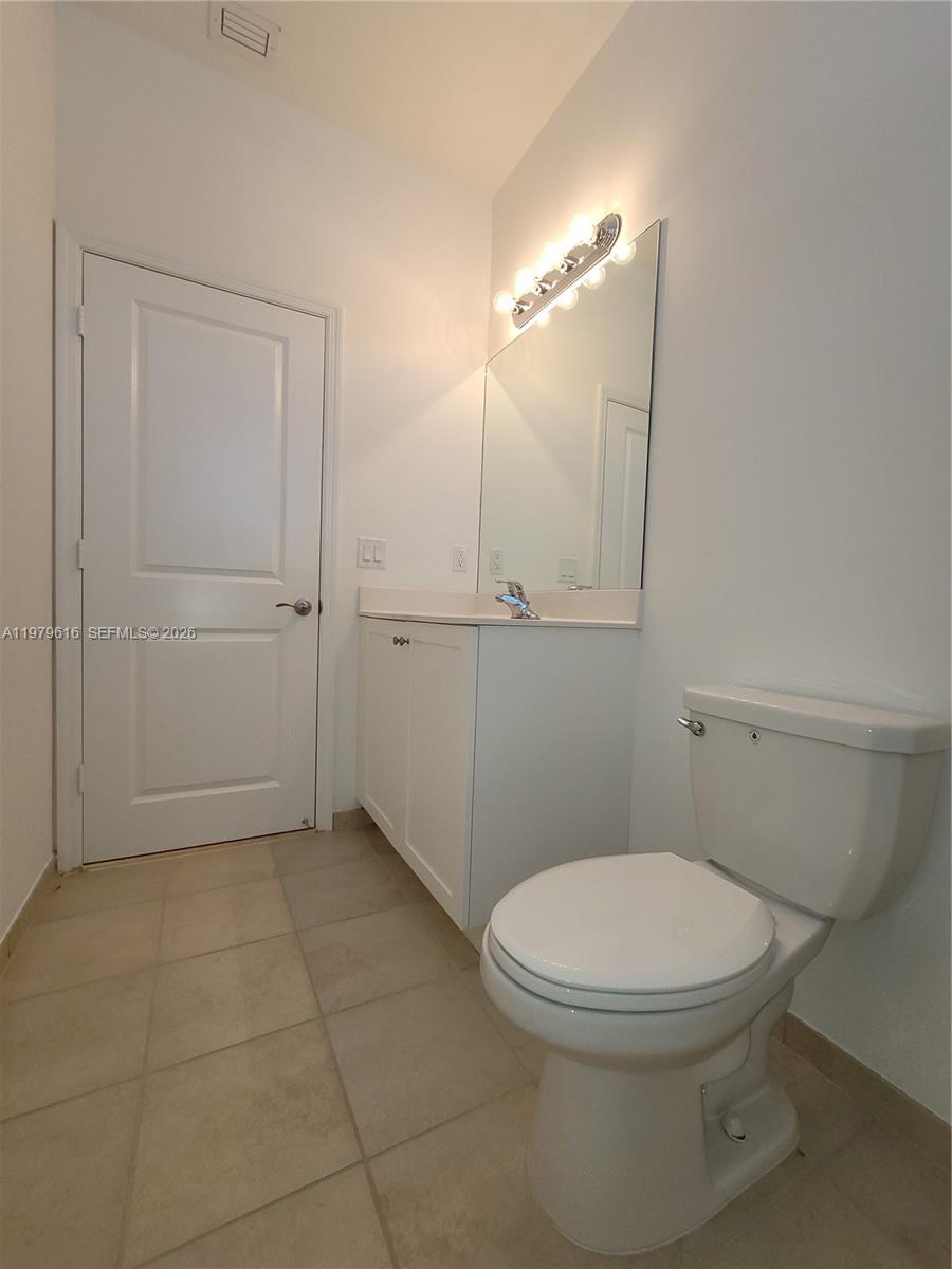 25039 Southwest 114th Avenue Homestead, FL 33032 - Photo 22 of 45 a bathroom with a toilet and a shower