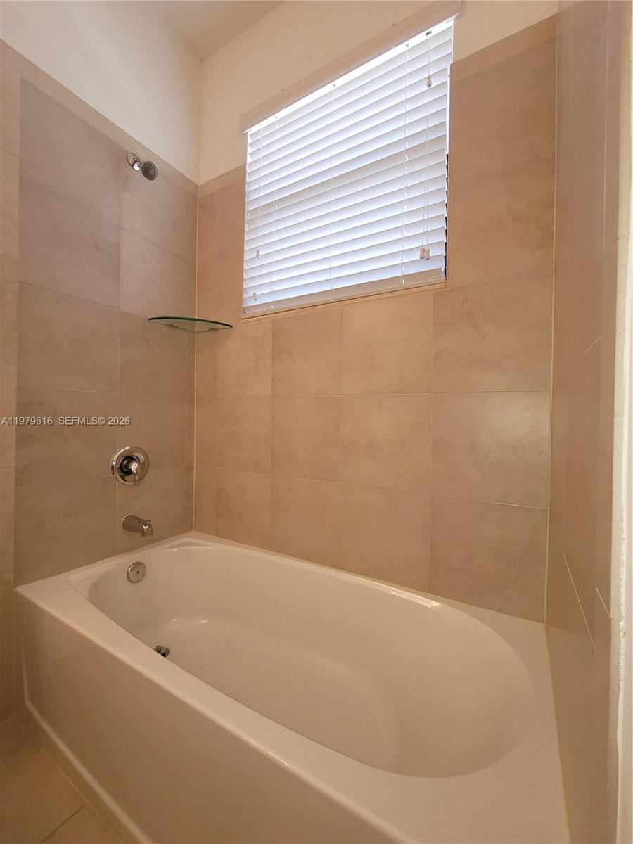 25039 Southwest 114th Avenue Homestead, FL 33032 - Photo 23 of 45 a bathroom with a bathtub
