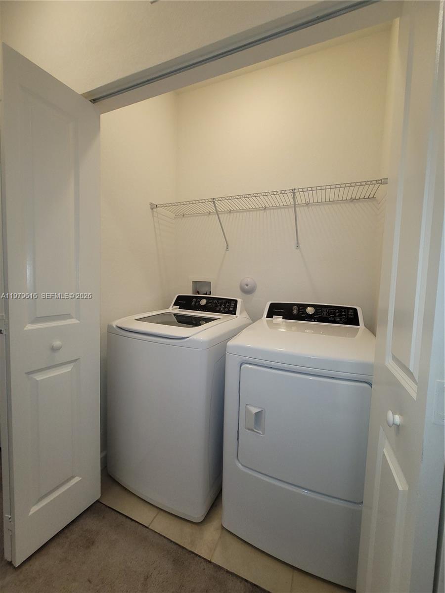 25039 Southwest 114th Avenue Homestead, FL 33032 - Photo 24 of 45 a utility room with dryer and washer