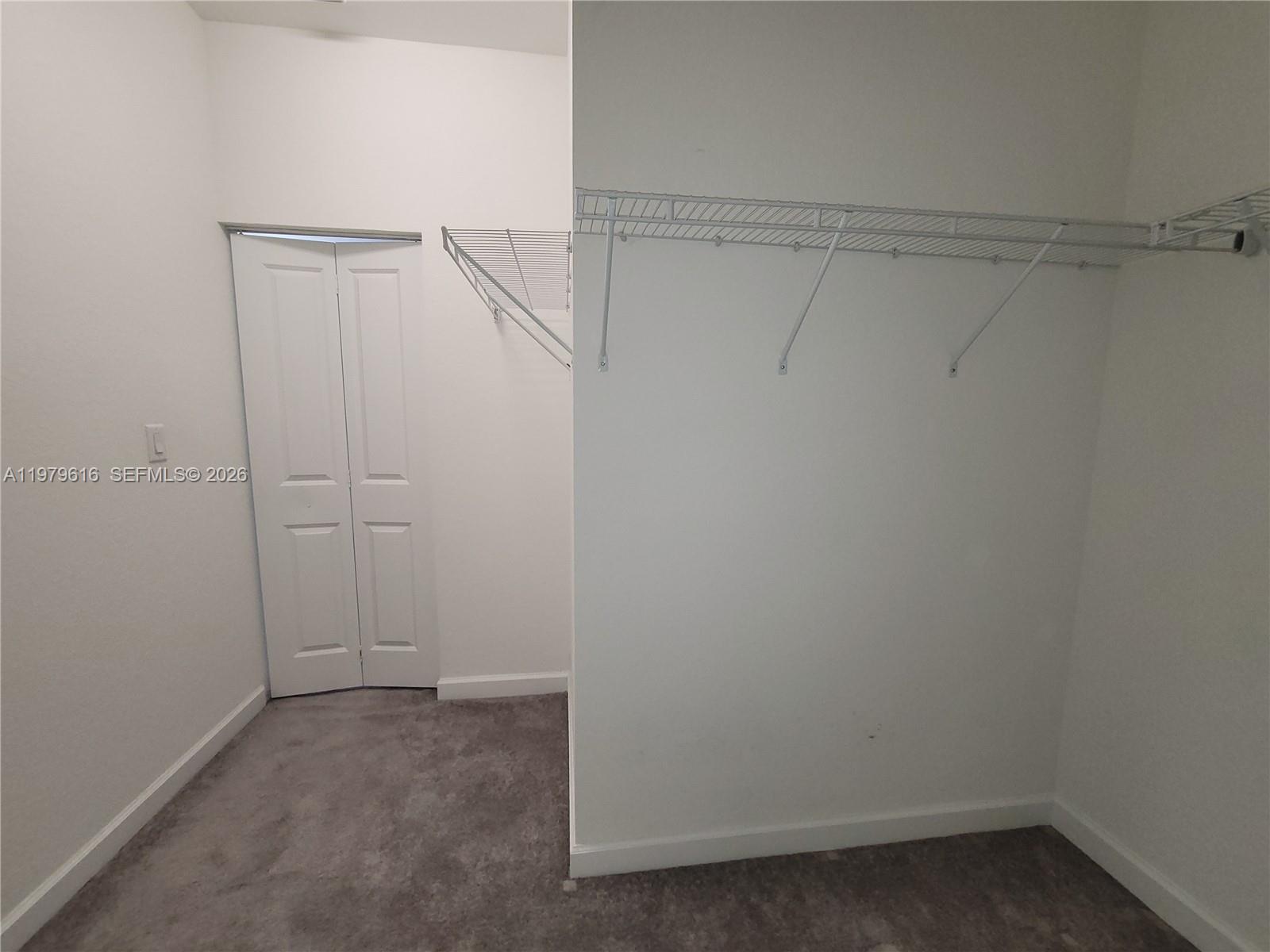 25039 Southwest 114th Avenue Homestead, FL 33032 - Photo 31 of 45 a view of an empty walk in closet