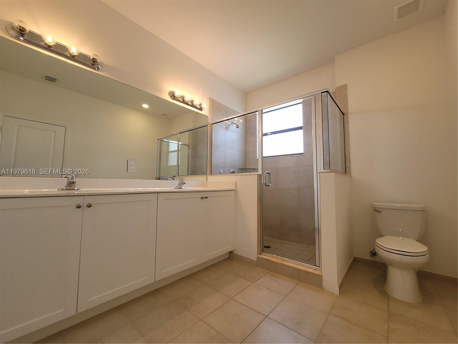 25039 Southwest 114th Avenue Homestead, FL 33032 - Photo 32 of 45 a bathroom with a sink toilet and shower