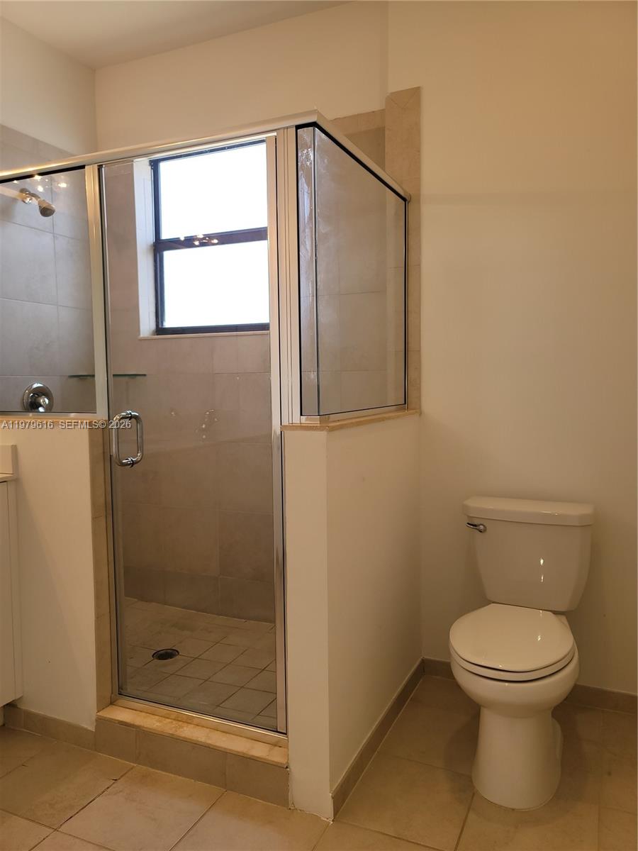 25039 Southwest 114th Avenue Homestead, FL 33032 - Photo 33 of 45 a bathroom with a toilet and a shower