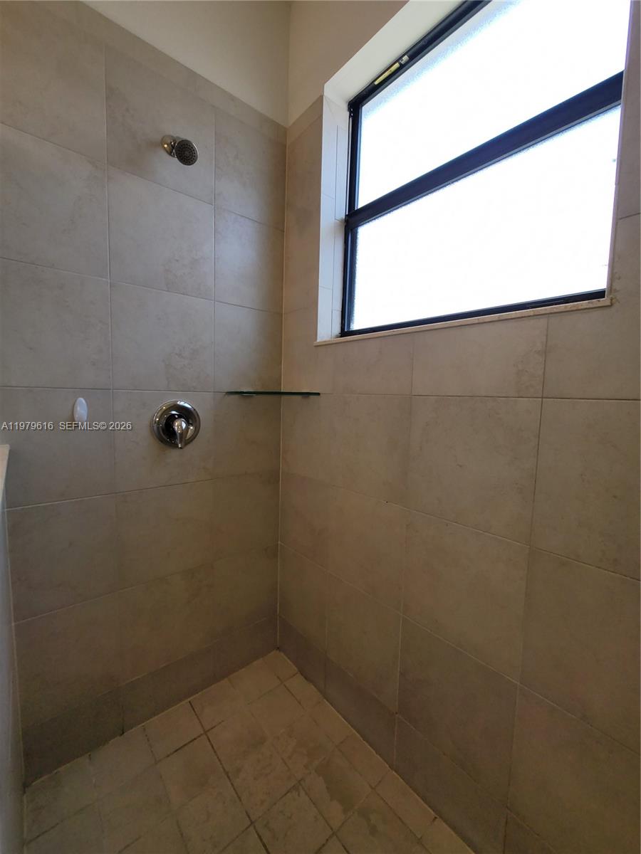 25039 Southwest 114th Avenue Homestead, FL 33032 - Photo 34 of 45 a bathroom with a window