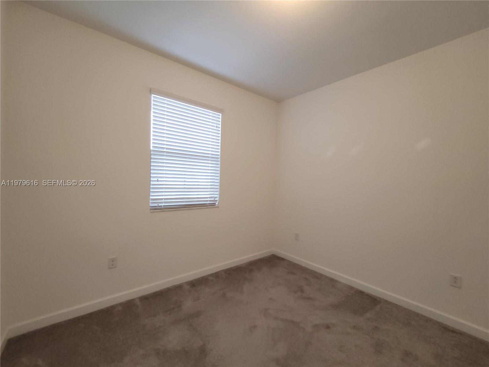 25039 Southwest 114th Avenue Homestead, FL 33032 - Photo 36 of 45 an empty room with a window