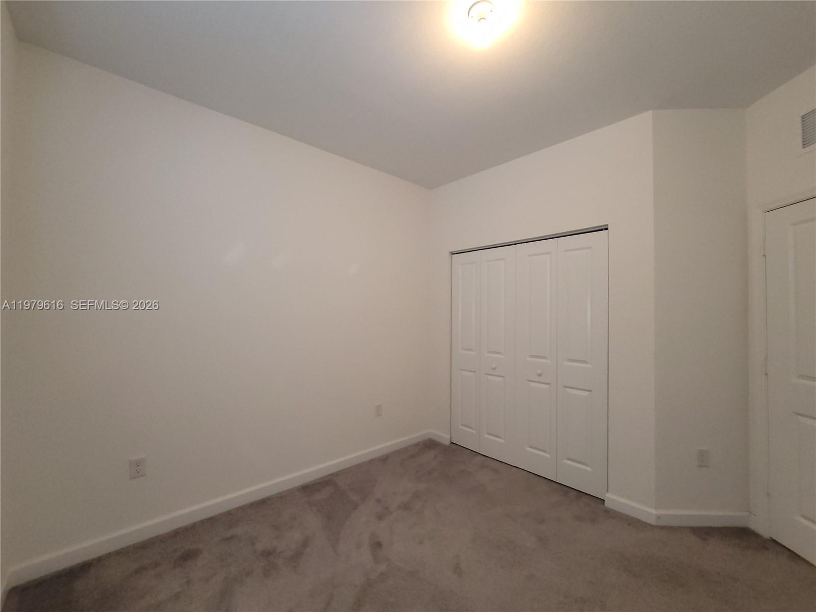 25039 Southwest 114th Avenue Homestead, FL 33032 - Photo 37 of 45 an empty room with closet