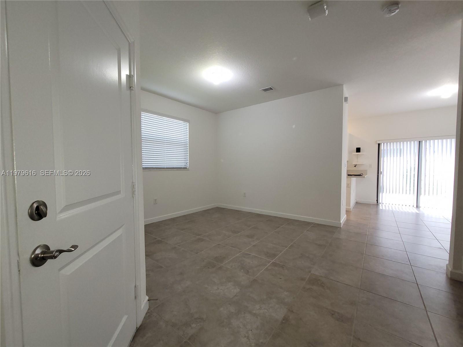 25039 Southwest 114th Avenue Homestead, FL 33032 - Photo 10 of 45 a view of a hallway with closet