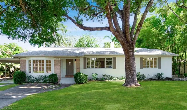 front view of a house with a yard