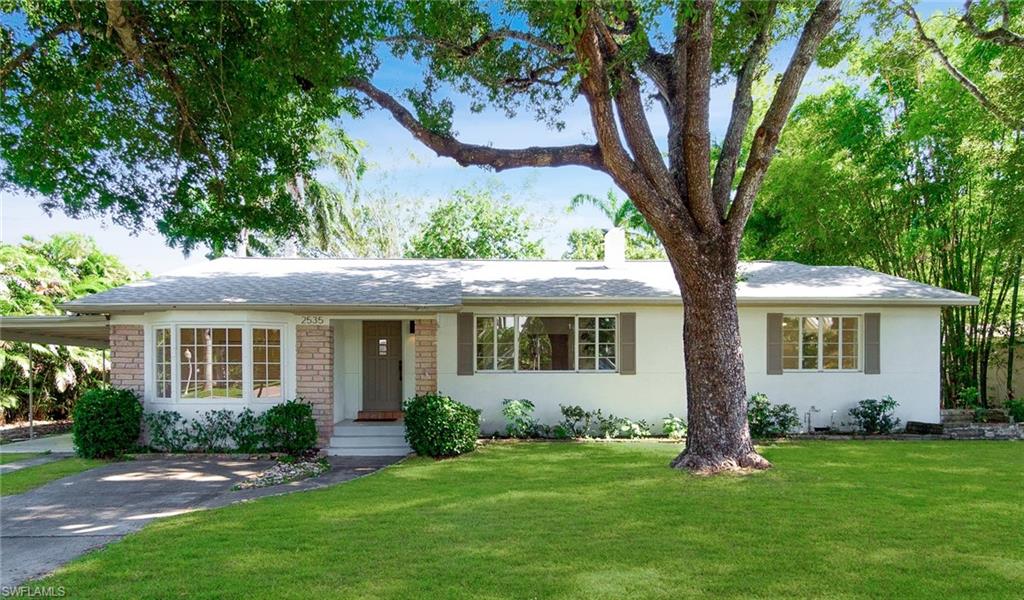 front view of a house with a yard