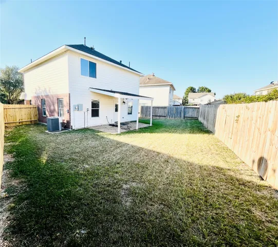 a view of a backyard of the house