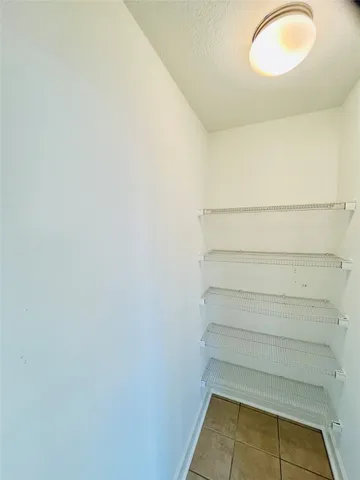 a view of storage and utility room with empty racks