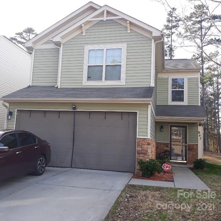847 Rook Road, Unit 74 Charlotte, NC 28216 - Photo 1 of 1 a front view of a house with garden